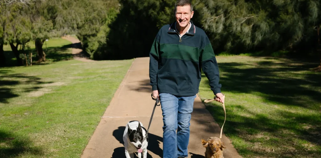 michael walking two dogs