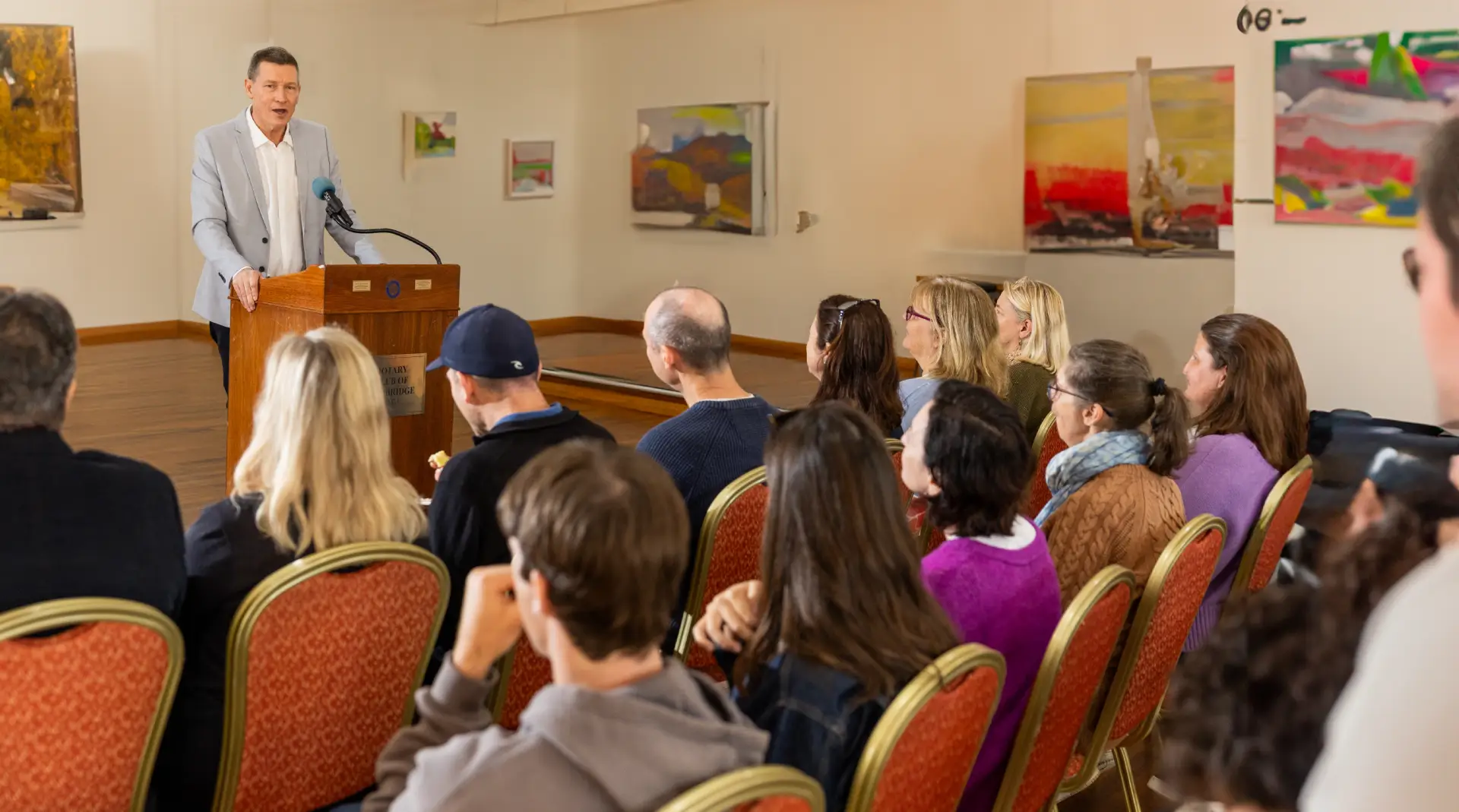 michael talking in front of a group of people
